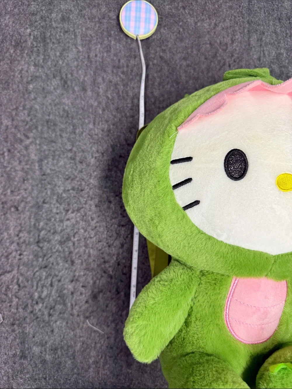 Sanrio Hello Kitty Plush in Green Dino Outfit with Pink Trim